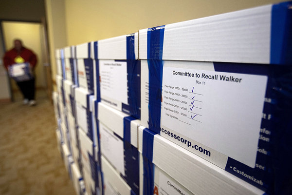 Boxes containing signatures to recall Gov. Scott Walker pile up in a store room at the Government Accountability Offices in Madison, Wisconsin on Tuesday.