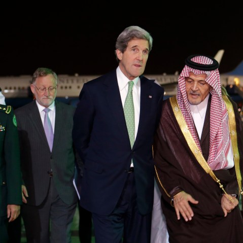 U.S. Secretary of State John Kerry, center, walks with Saudi Foreign Minister Prince Saud al-Faisal, as Kerry arrives in Riyadh, Saudi Arabia on Sunday, March 3, 2013. Saudi Arabia is the seventh leg of Kerry's first official overseas trip. (Photo by...