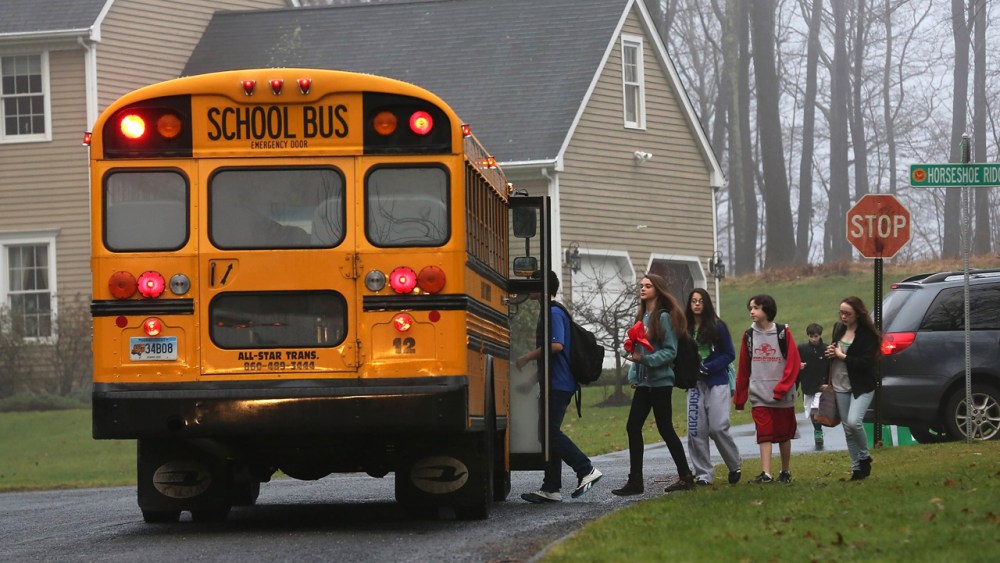 Children return to school on December 18, 2012 in Newtown, Connecticut, four days after the Sandy Hook Elementary massacre. (John Moore/Getty Images)
