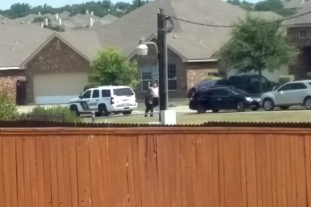 Bystander Michael Thomas captured this video of Gilbert Flores, 41, in which he appears to raise his hands before being shot by police just before noon on Aug. 28 in San Antonio, Texas.