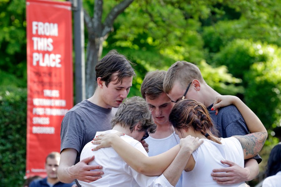 Image: Students and faculty pray together