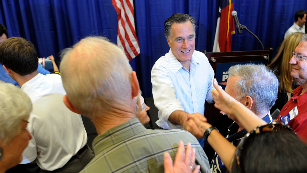 Former Republican presidential candidate Mitt Romney greets an enthusiastic crowd during a campaign event for Republican senate candidate David Perdue on Oct. 29, 2014, in Augusta, Ga. (Michael Holahan/The Augusta Chronicle/AP)