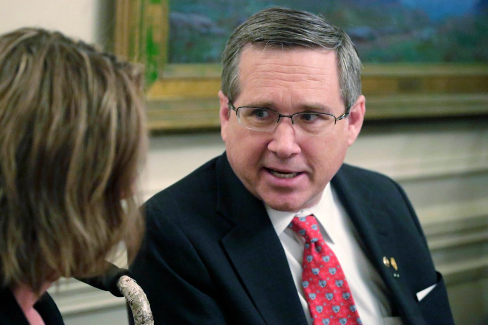 U.S. Sen. Mark Kirk, R-Ill., speaks to Illinois Republican Senate leader Christine Radogno during a Kirk fundraiser, on March 16, 2015, in Chicago.