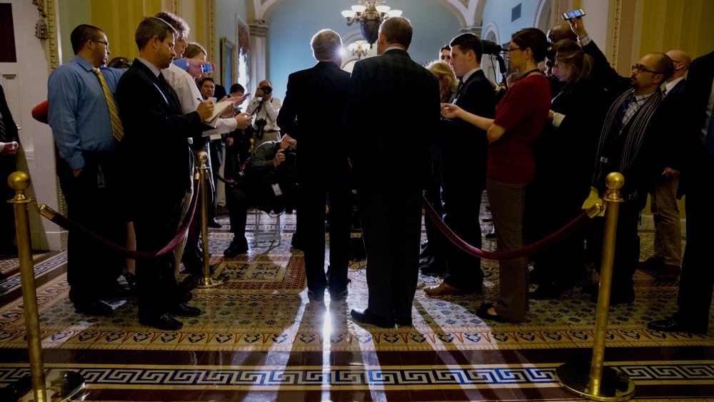 Senator Lamar Alexander, R-Tenn., having done an about-face on the filibuster since President Obama took office, looks over the shoulder of Senate Minority Leader Mitch McConnell of Ky., during a news conference on Capitol Hill in Washington, November 21,