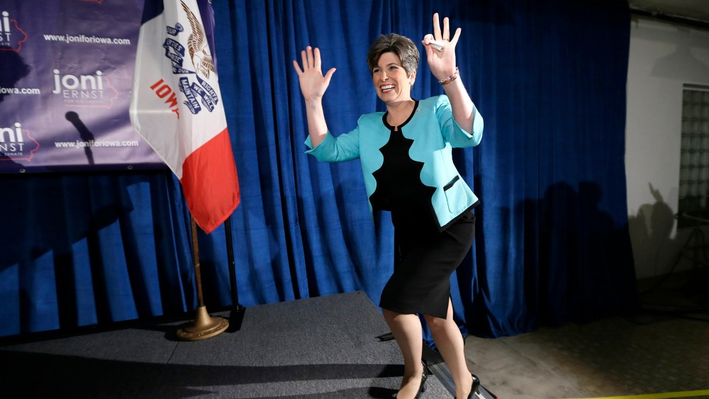 State Sen. Joni Ernst waves to supporters at a primary election night rally in Des Moines, Iowa, June 3, 2014.