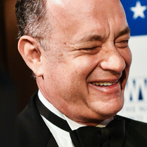 Tom Hanks smiles on the red carpet held at Cipriani on Wall Street, N.Y., for the WWII Museum, where Tom Brokaw and Tom Hanks received the Spirit Award, Feb. 24, 2015. (Photo by Sean Zanni/Patrick McMullan)