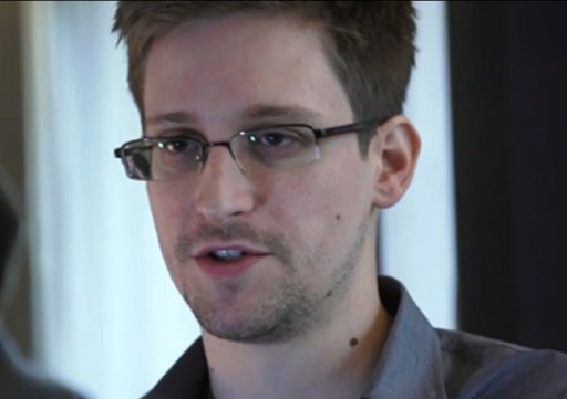 A television screens the image of former U.S. spy agency contractor Edward Snowden during a news bulletin at a cafe at Moscow's Sheremetyevo airport June 26, 2013. Russian President Vladimir Putin confirmed on Tuesday that Snowden, sought by the United...