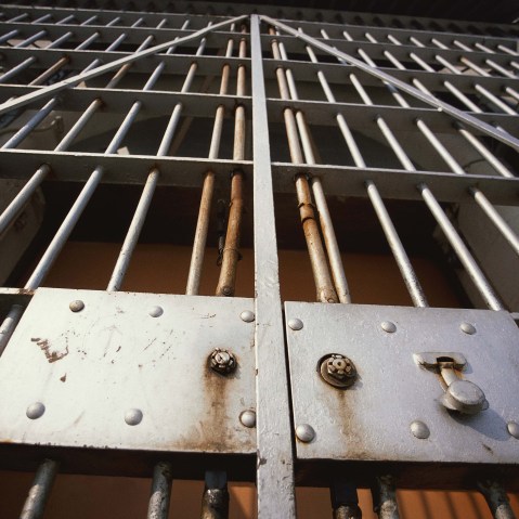 Prison Bars. (Stock photo by GeoStock/Photodisc/Getty Images)