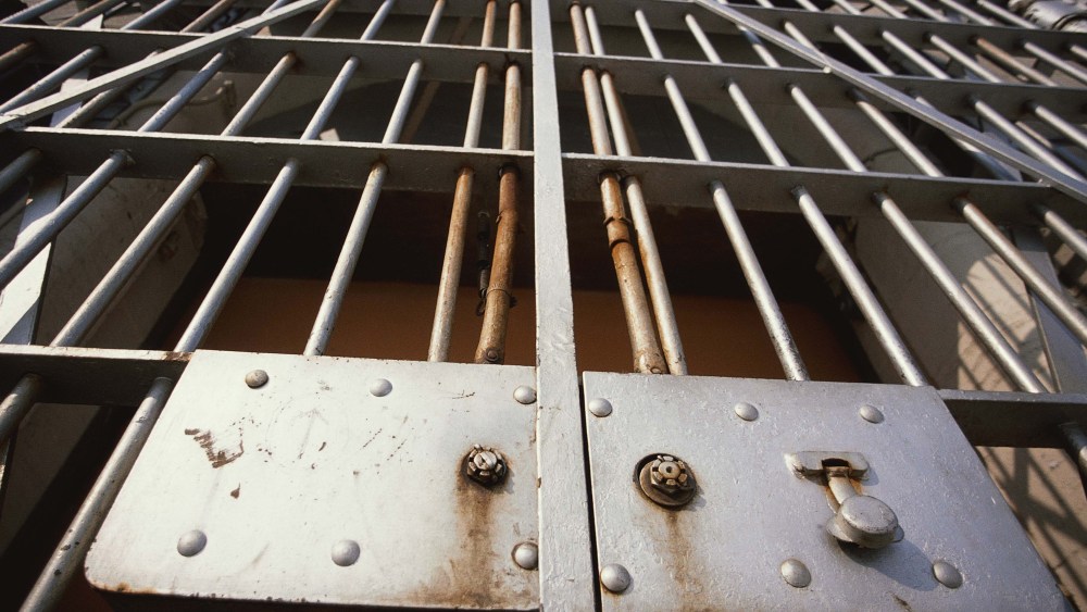 Prison Bars. (Stock photo by GeoStock/Photodisc/Getty Images)