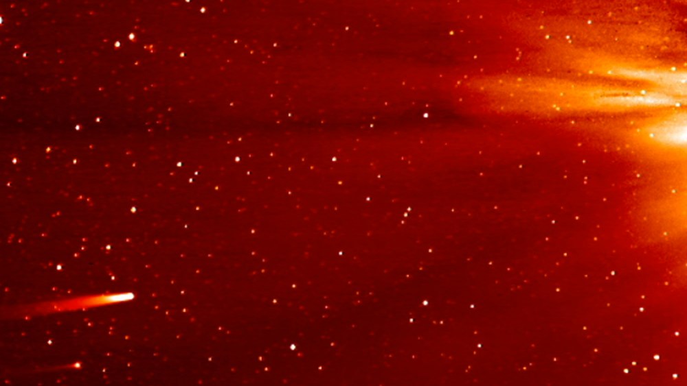 In this frame grab taken from enhanced video made by NASA's STEREO-A spacecraft, comet ISON, left, approaches the sun on Nov. 25, 2013.