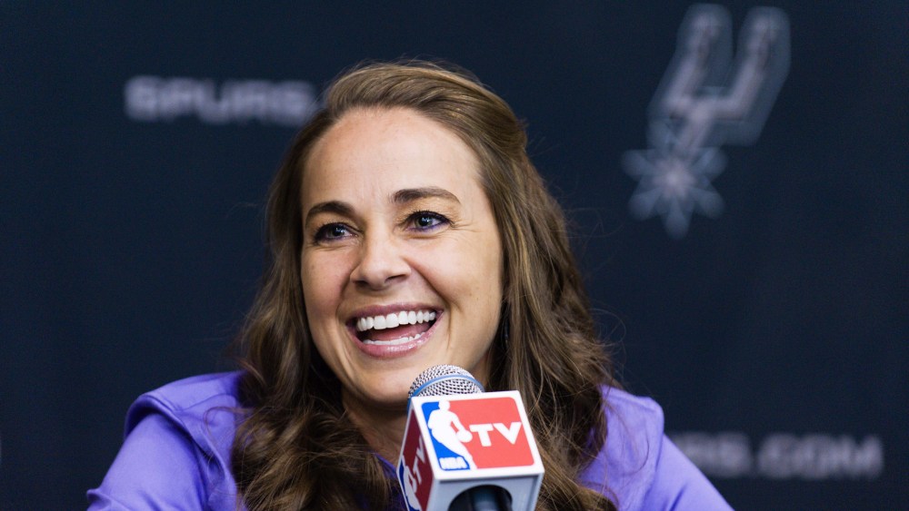 WNBA star Becky Hammon takes questions from the media at the San Antonio Spurs practice facility after being introduced as an assistant coach with the team, Aug. 5, 2014.