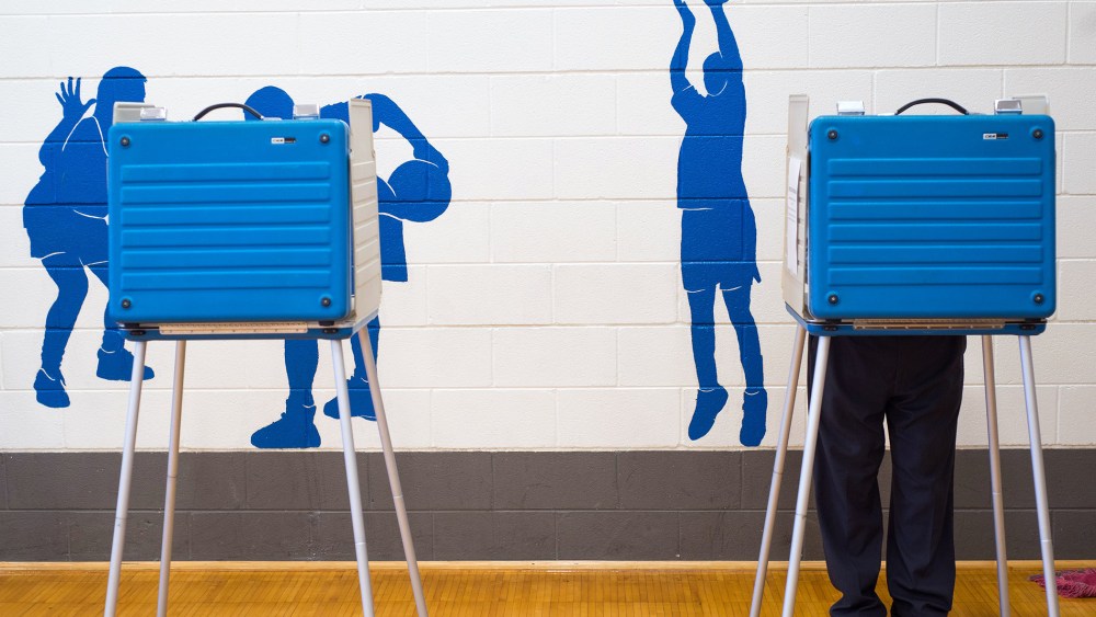 A voter fills out a ballot at Thomas Jefferson Elementary School in Forest, Va., on election day, Nov. 3, 2015. (Photo by Autumn Parry/News & Daily Advance/AP)