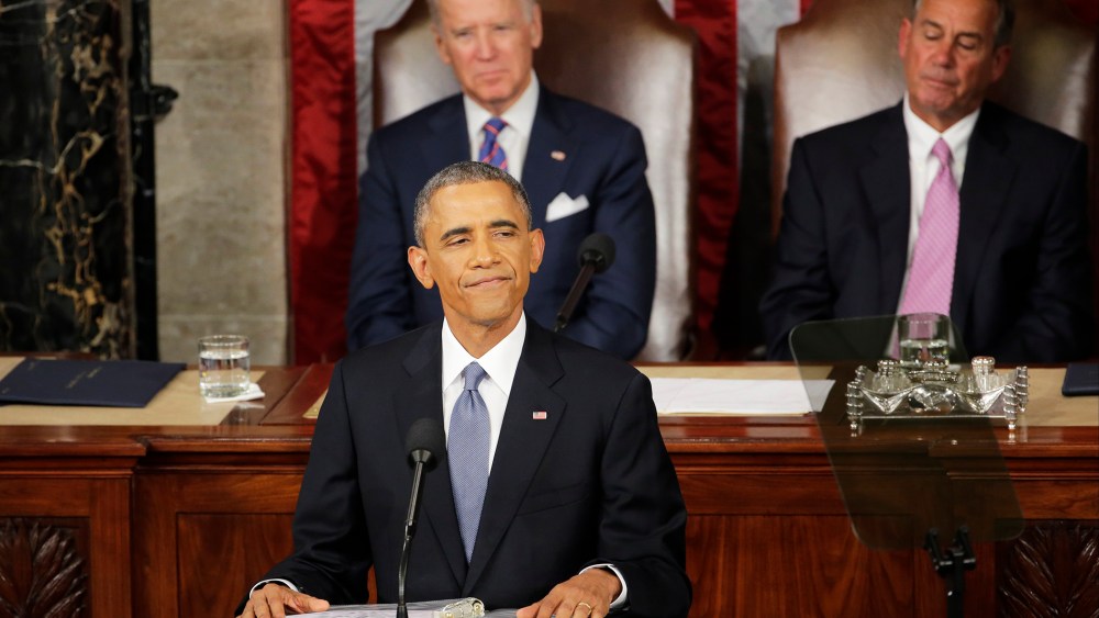 President Barack Obama pauses during his State of the Union address before a joint session of Congress on Capitol Hill in Washington, D.C., Jan. 20, 2015. (Photo by J. Scott Applewhite/AP)