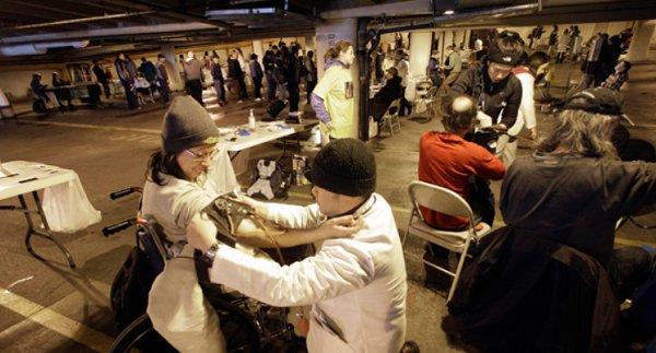 The uninsured seek health care at a free clinic.