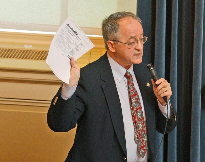 Del. Robert Marshall, R-Prince William, holds a paper as he talks about his Personhood bill during the House session at the Capitol in Richmond, Va., Tuesday, Feb. 14, 2012.