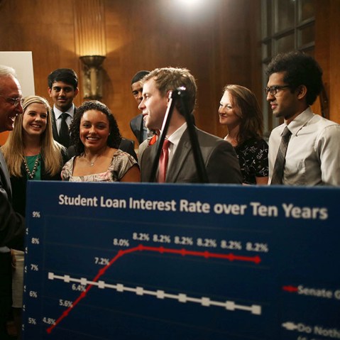 Senate Health, Education, Labor and Pensions Committee Chairman Tom Harkin (D-IA)(L) talks with students during a news conference on Capitol Hill, June 6, 2013 in Washington, D.C. (Photo by Mark Wilson/Getty Images)