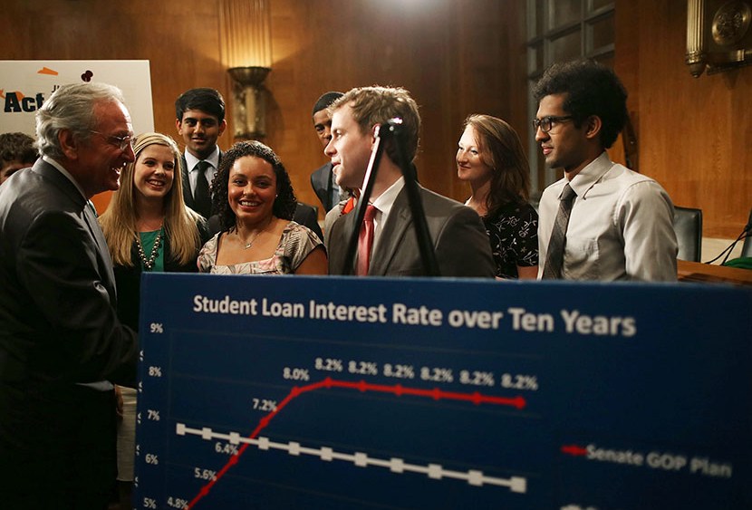 Senate Health, Education, Labor and Pensions Committee Chairman Tom Harkin (D-IA)(L) talks with students during a news conference on Capitol Hill, June 6, 2013 in Washington, D.C. (Photo by Mark Wilson/Getty Images)