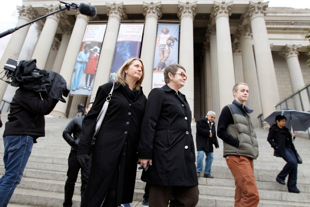 Sandy Stier, left, and Kris Perry of Berkeley, Calif., arrive at the National Archives in Washington, Monday, March 25, 2013, to view the U.S. Constitution, a day before their same-sex marriage case is heard before the Supreme Court. (AP Photo/Jose...