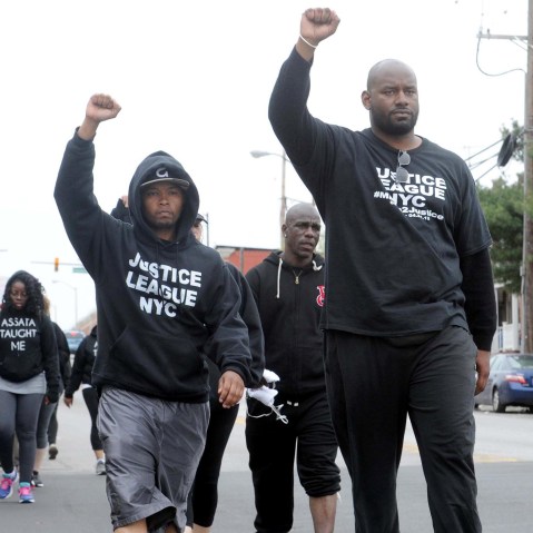 Citizens and groups such as the Justice League of NYC protest against the police following the death of Freddie Gray, on April 19, 2015, in Baltimore.