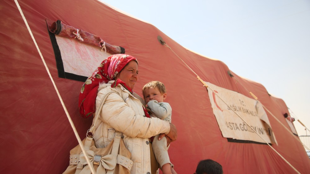 Syrian Kurds Fleeing The Islamic State Militants Cross Into Turkey