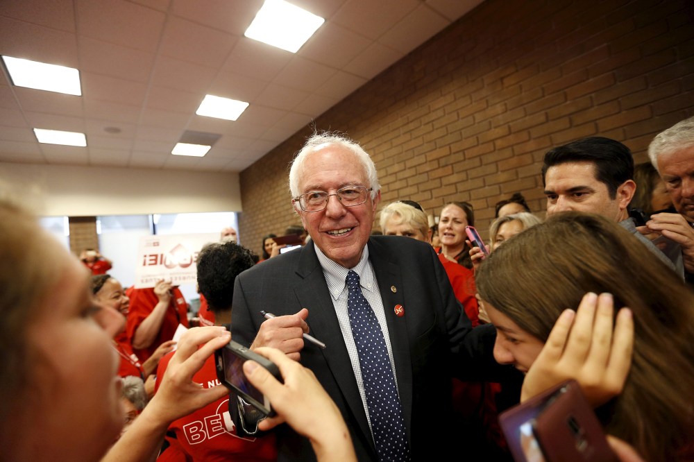 Vermont Senator and U.S. Democratic presidential candidate Bernie Sanders (C) greets the crowd during a "Brunch With Bernie" rally at National Nurses United in Oakland, Calif., Aug. 10, 2015. (Photo by Stephen Lam/Reuters)