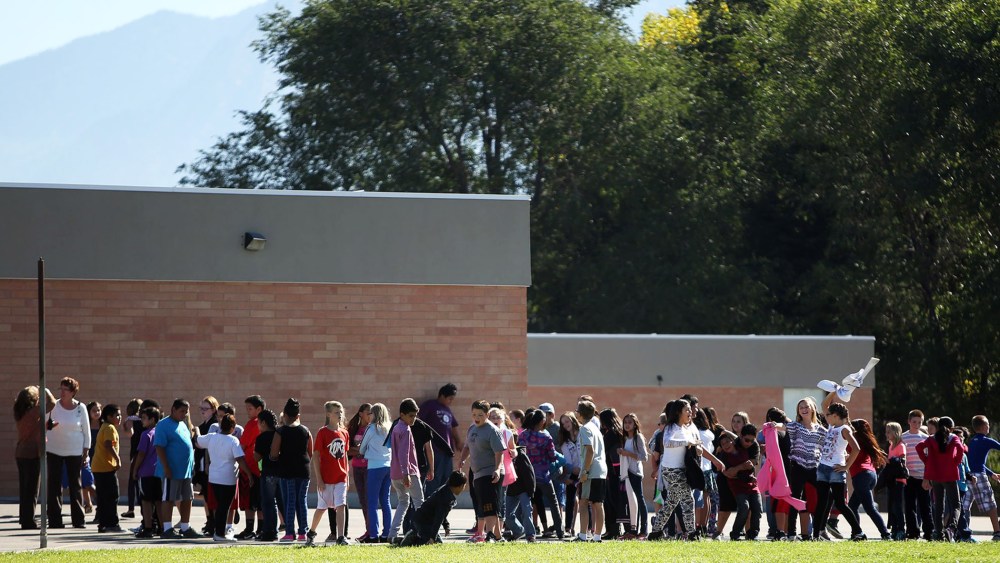 Students line up to go back inside after recess at Westbrook Elementary School in Taylorsville, Utah, Thursday, Sept. 11, 2014. Earlier, a teacher accidentally shot herself in the leg, while alone in a faculty bathroom, shortly before school started.
