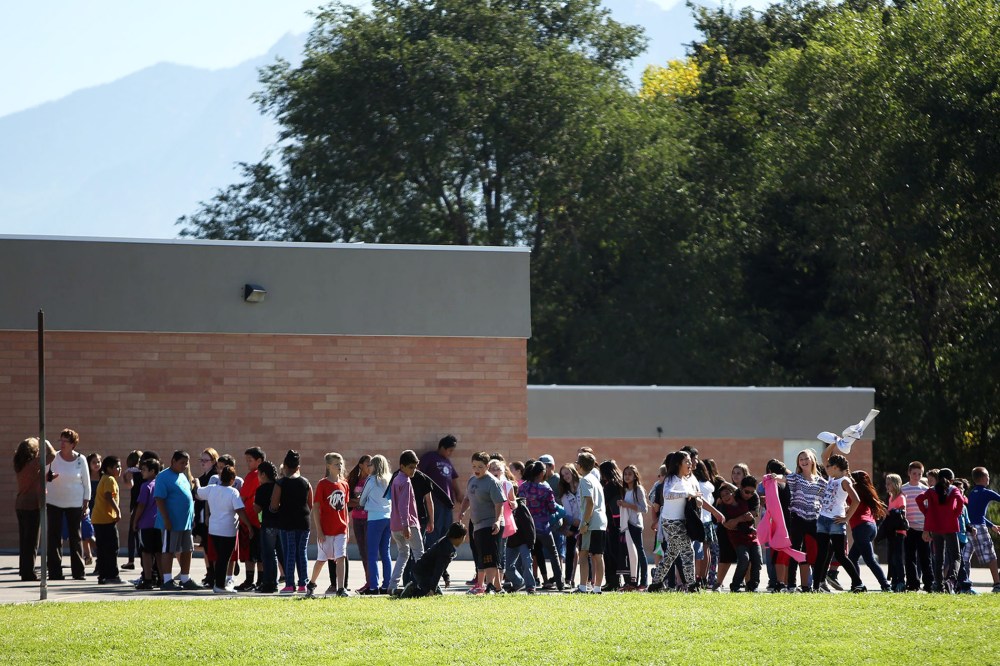 Students line up to go back inside after recess at Westbrook Elementary School in Taylorsville, Utah, Thursday, Sept. 11, 2014. Earlier, a teacher accidentally shot herself in the leg, while alone in a faculty bathroom, shortly before school started.
