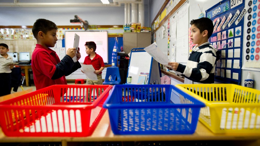 Josue Rodgriquez, 7, (left) records fellow second grader Santiago Gorostieta, 8, as he reads a Spanish-language poster he created at Treadwell Elementary School in Memphis, Tenn., Friday, January 10, 2014.