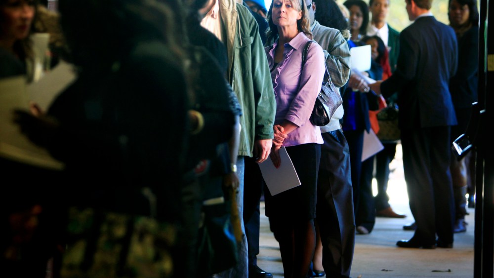 Jona Caldwell joins a long line of job seekers outside the Ferguson Community Center in Cordova, Tenn. waiting to get into a Tennessee Department of Labor job fair Thursday, Nov. 7, 2013.