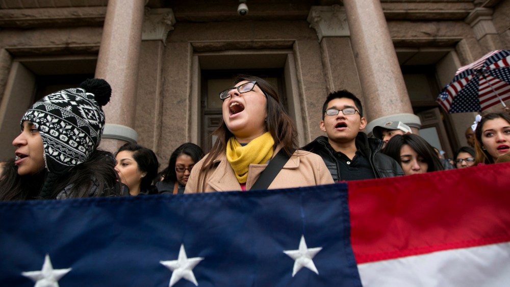 Maria Yolisma Garcia, 20, of Dallas, center, rallies in support of the HB1403, the Texas DREAM Act, at a demonstration at the Capitol in Austin, Texas, on Jan. 14, 2015. (Photo by Jay Janner/Austin American-Statesman/AP)