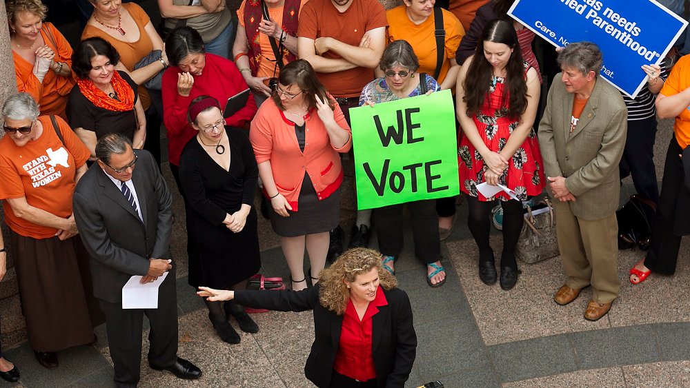 Various Texas legislators, including Rep. Donna Howard, gathered in the open-air rotunda to show their support for Women's Health issues and concerns at the Texas State Capitol Thursday, Feb. 20, 2014.