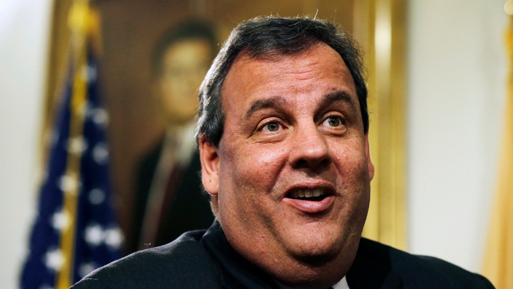 New Jersey Gov. Chris Christie smiles as he listens to a question in Trenton, N.J., Dec. 13, 2013.