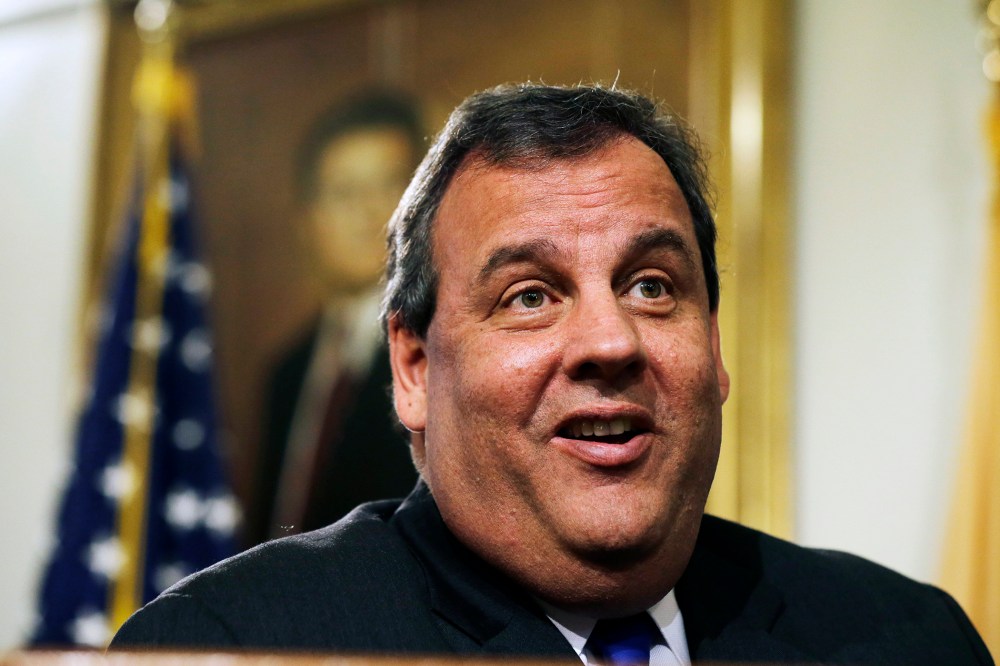 New Jersey Gov. Chris Christie smiles as he listens to a question in Trenton, N.J., Dec. 13, 2013.