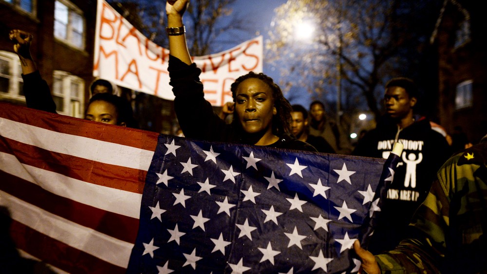 Demonstrators shout slogans during a march in St. Louis, Missouri, on Nov. 23, 2014 to protest the death of 18-year-old Michael Brown.