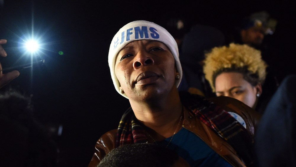 Michael Brown's mother Leslie McSpadden cries outside the police station in Ferguson, Mo. on Nov. 24, 2014 after hearing the grand jury decision on her son's fatal shooting