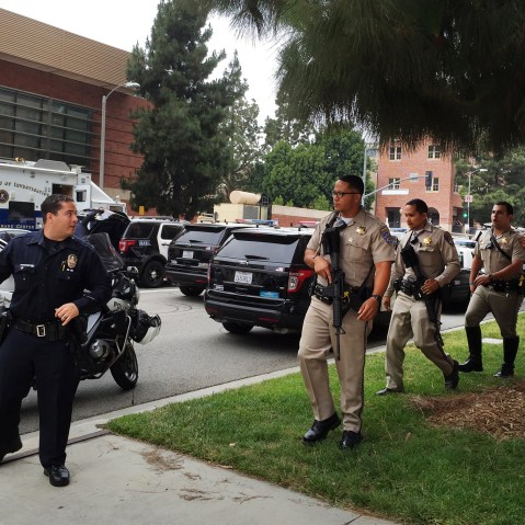 A Los Angeles policeman and Sheriff deputies work at the scene of a fatal shooting at the University of California, Los Angeles, June 1, 2016. (Photo by Ringo H.W. Chiu/AP)
