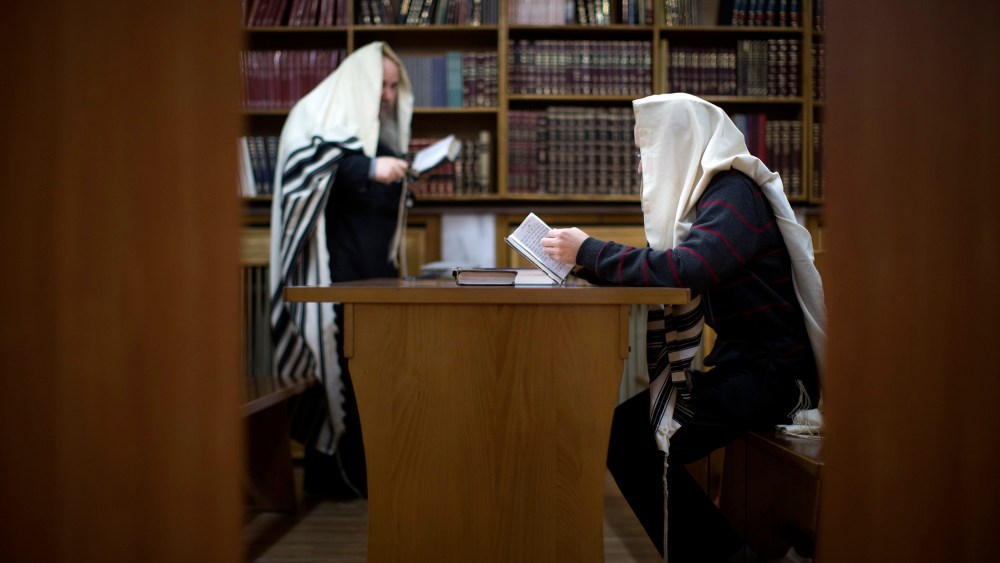 Two Jewish men read prayers in a synagogue in Donetsk, Ukraine, on April 18, 2014.