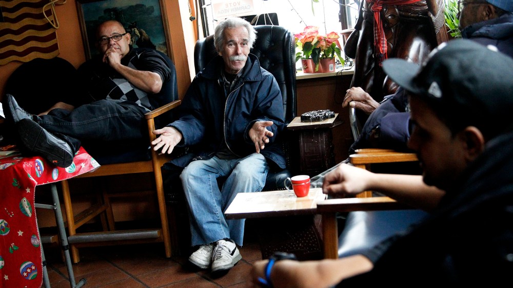 Roberto Martinez Gonzalez, 73, second from left, an former Cuban national who left his birth country during the El Mariel exodus, talks to Manuel Lopez, Juan Perez and Tony Montalvo regarding Cuba at a cigar shop on Dec. 17, 2014, in Union City, N.J.