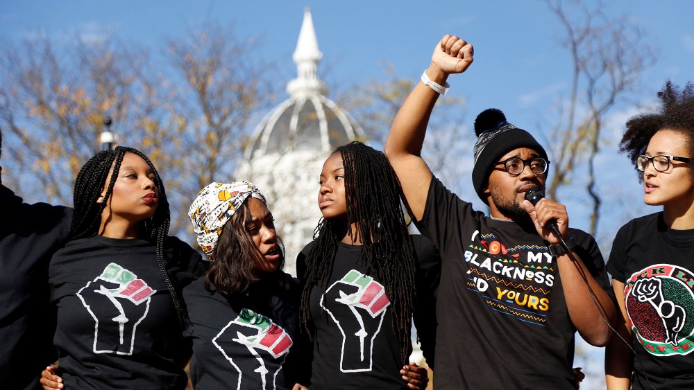 Concerned Student 1950, led by University of Missouri graduate student Jonathan Butler, second from right, speaks following the announcement that University of Missouri System President Tim Wolfe would resign, Nov. 9, 2015, in Columbia, Mo.