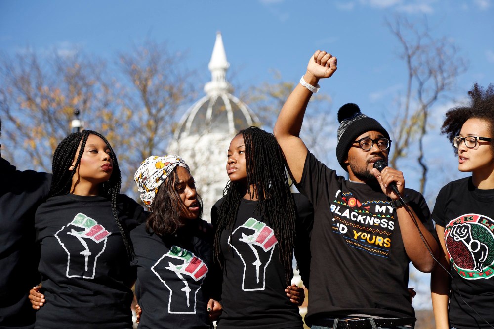 Concerned Student 1950, led by University of Missouri graduate student Jonathan Butler, second from right, speaks following the announcement that University of Missouri System President Tim Wolfe would resign, Nov. 9, 2015, in Columbia, Mo.