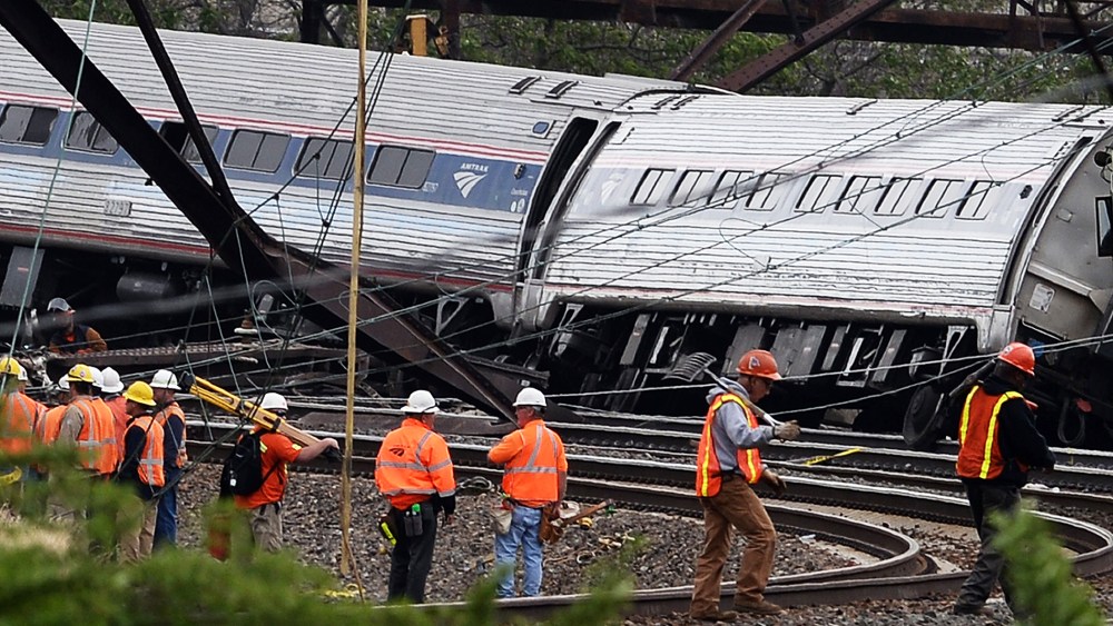 Rescuers work around derailed carriages of an Amtrak train in Philadelphia, Pa. on May 13, 2015. (Photo by Jewel Samad/AFP/Getty)