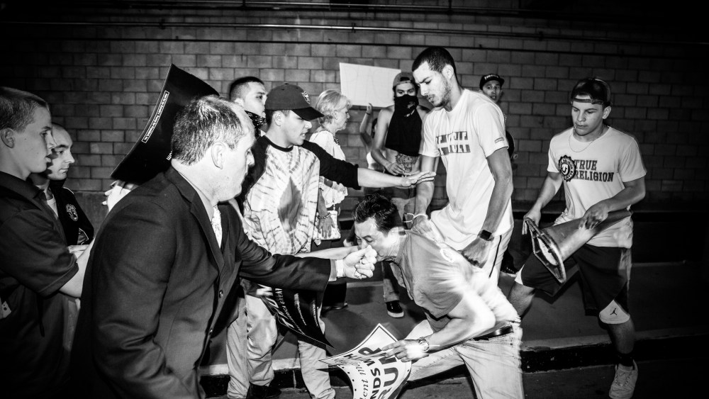 Donald Trump protesters and supporters clash inside a parking lot near Trump's election rally in San Jose, Calif., June 2, 2016. (Photo by Mark Peterson/Redux for MSNBC)