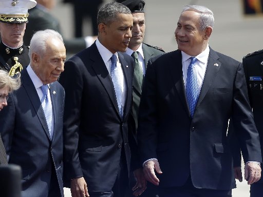 President Barack Obama is greeted by Israeli President Shimon Perez, left, and Israeli Prime Minister Benjamin Netanyahu, right, upon his arrival ceremony at Ben Gurion International Airport in Tel Aviv, Israel, Wednesday, March 20, 2013. (AP Photo...