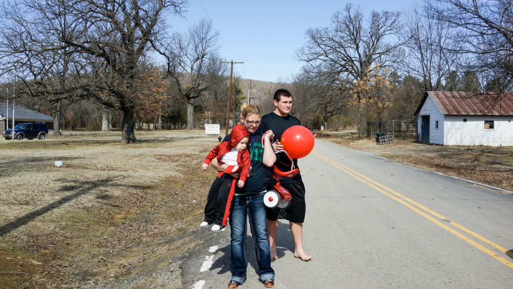 Autumn and Mike Sisco with their son Bobby in Quinton, Okla. Autumn and Mike had their son when she was 17 and he was 15.