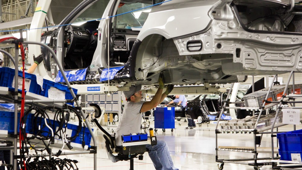 In this July 31, 2012, file photo, an employee works on a Passat sedan at the Volkswagen plant in Chattanooga, Tenn.