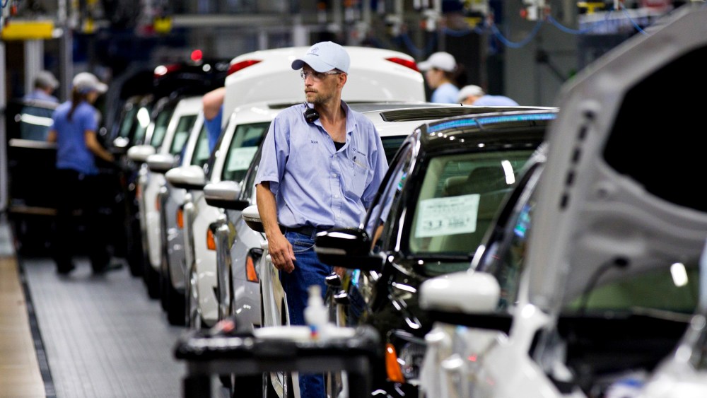 An employee at the Volkswagen plant in Chattanooga, Tenn., works on a Passat sedan on July 31, 2012.