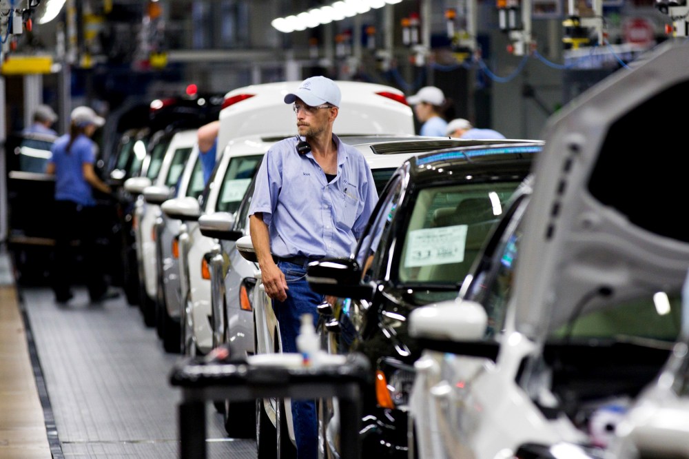 An employee at the Volkswagen plant in Chattanooga, Tenn., works on a Passat sedan on July 31, 2012.