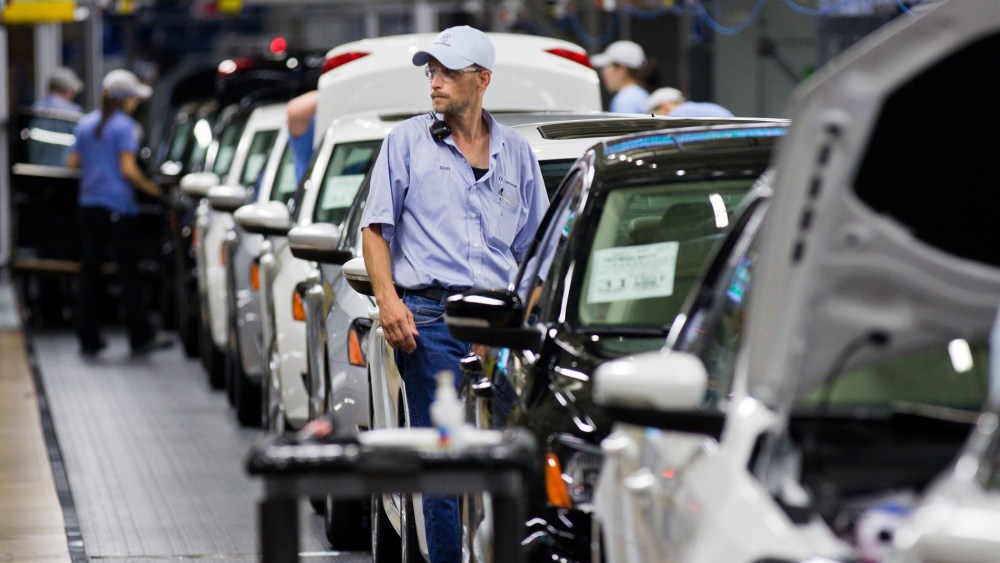 In this July 31, 2012 file photo, an employee at the Volkswagen plant in Chattanooga, Tenn., works on a Passat sedan.