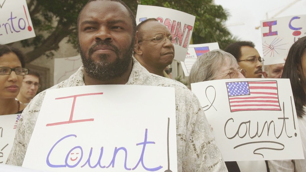 File Photo: Felon Leroy Jones joins other demonstrators outside court in Miami, Wednesday, April 9, 2003, where the 11th U.S. Circuit Court of Appeals heard arguments on whether the state is doing enough to help ex-felons restore their voting rights. ...