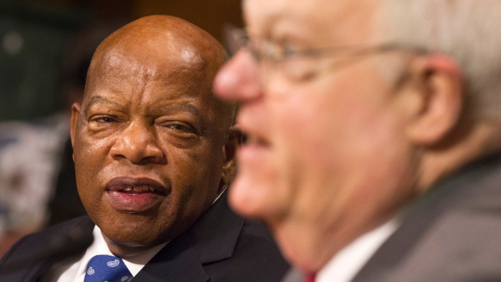 Rep. John Lewis, D-Ga., left, turns to thank Rep. James Sensenbrenner, R-Wis., as he finishes his testimony in support of the Voting Rights Act on Capitol Hill in Washington, July 17, 2013.